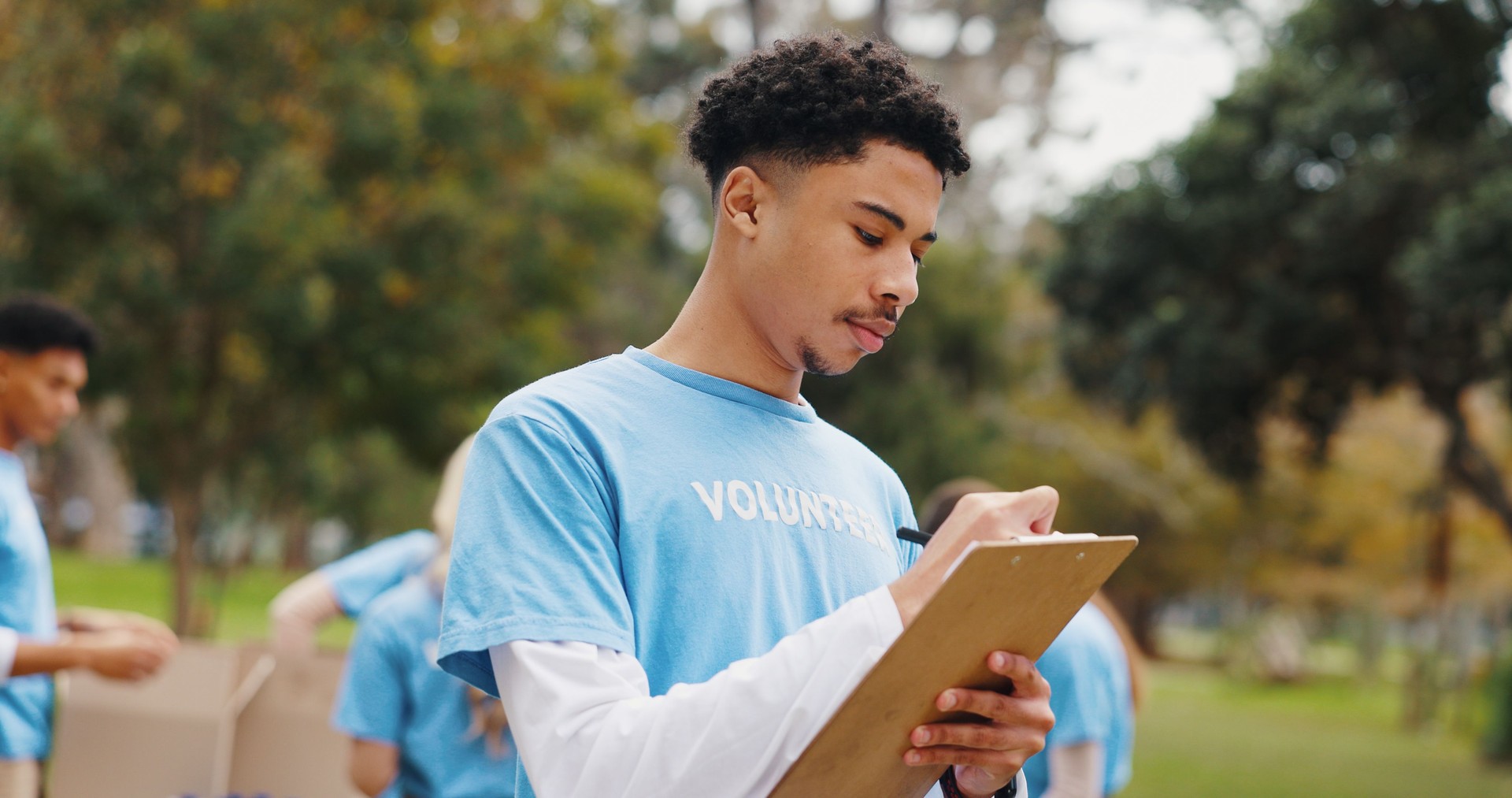 Checklist, volunteer and man in park planning schedule for sustainable green project at ngo. Clipboard, sign up and girl in nature with application for community service with social responsibility